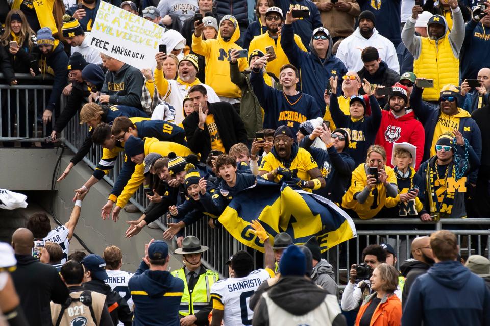 Michigan fans cheer on the Wolverines after a 24-15 win over Penn State at Beaver Stadium Saturday, Nov. 11, 2023, in State College, Pa.