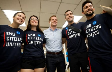 Dan McCready, Democratic candidate in the special election for North Carolina's 9th Congressional District, poses for a photograph with volunteers at his campaign headquarters on election day, in Charlotte, North Carolina