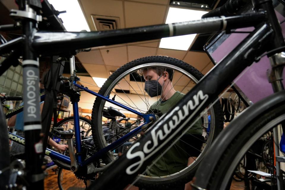 Charlotte Merrick learns about bicycle maintenance at the Providence Bike Collective.