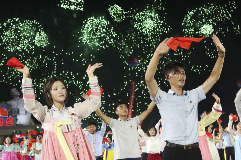 North Koreans celebrate the country's 76th founding anniversary at Kim Il Sung Square in Pyongyang, North Korea Sunday, Sept. 8, 2024. (AP Photo/Jon Chol Jin)