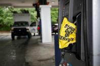 Bagged pump nozzle notifies motorists that it no longer has fuel during fuel run in Chapel Hill, North Carolina