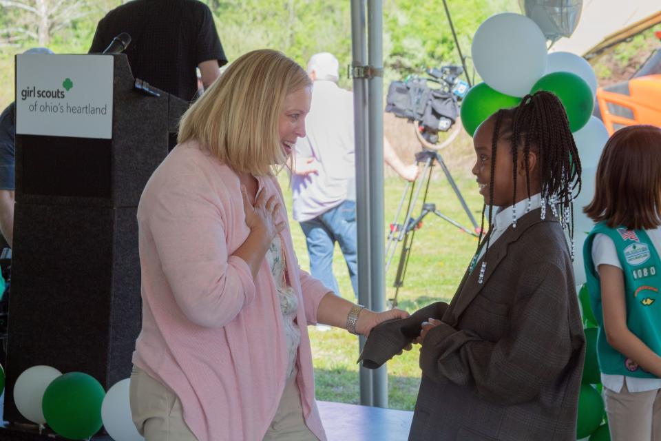 Lori Gillett, CEO of CK Construction in Westerville, talks to Jasmine Davis, a Junior Girl Scout, at the Girl Scouts of Ohio's Heartland's groundbreaking celebration Tuesday for its new STEM Leadership Center & Maker Space in Galloway.