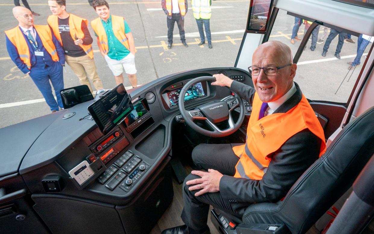 SNP leader John Swinney is pictured today during a visit to meet an innovative consortium of bus operators, led by Zenobe, and confirm Scottish Government support for zero-emission public transport across Scotland, at the Stagecoach depot in Dunfermline