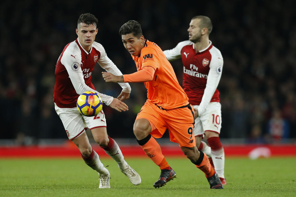 Roberto Firmino duels with Granit Xhaka and Jack Wilshere during Friday’s 3-3 draw between Liverpool and Arsenal. (Getty)