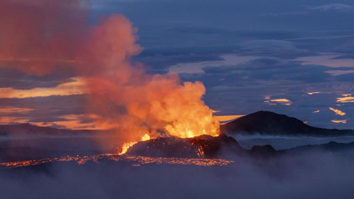 Fagradalsfjall volcano in Iceland erupting at dusk