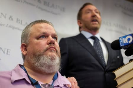 Geoffrey Johnson and his attorney Daniel J. Callahan speak in a news conference announcing a lawsuit against his former lawyer Michael Avenatti over a 4 million dollar settlement with the County of Los Angeles in Santa Ana