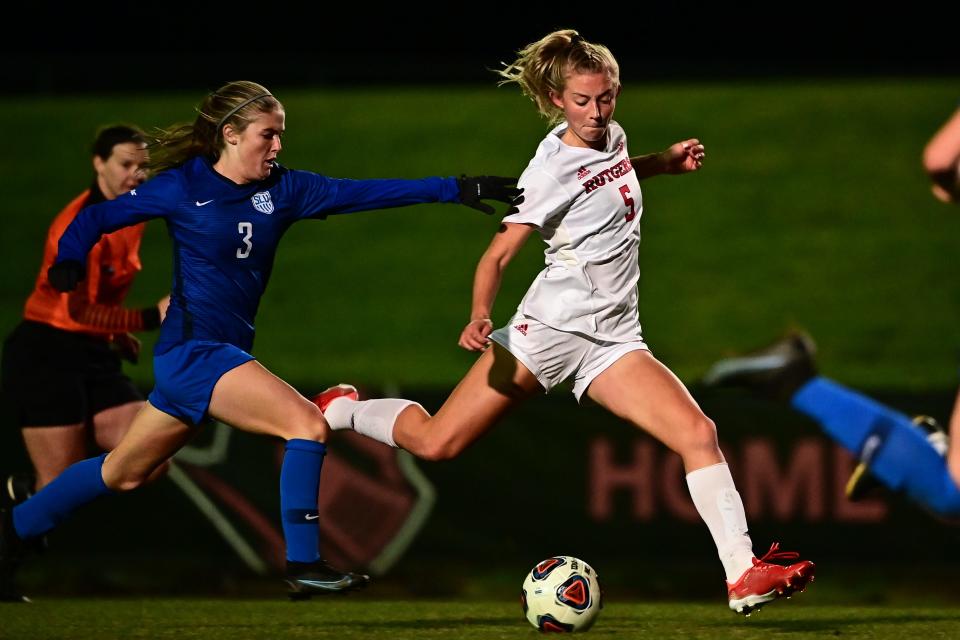 Rutgers' midfielder Becci Fluchel flies past Saint Louis players in the Second Round of the NCAA Tournament on Fri., Nov. 19, 2021, at Yurcak Field in Piscataway.