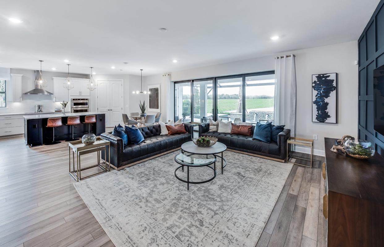 The Easley design offers more than 2,600 square feet with an open floor plan featuring a connected kitchen, café, gathering room, and formal dining area to make everyday living and entertaining a breeze.