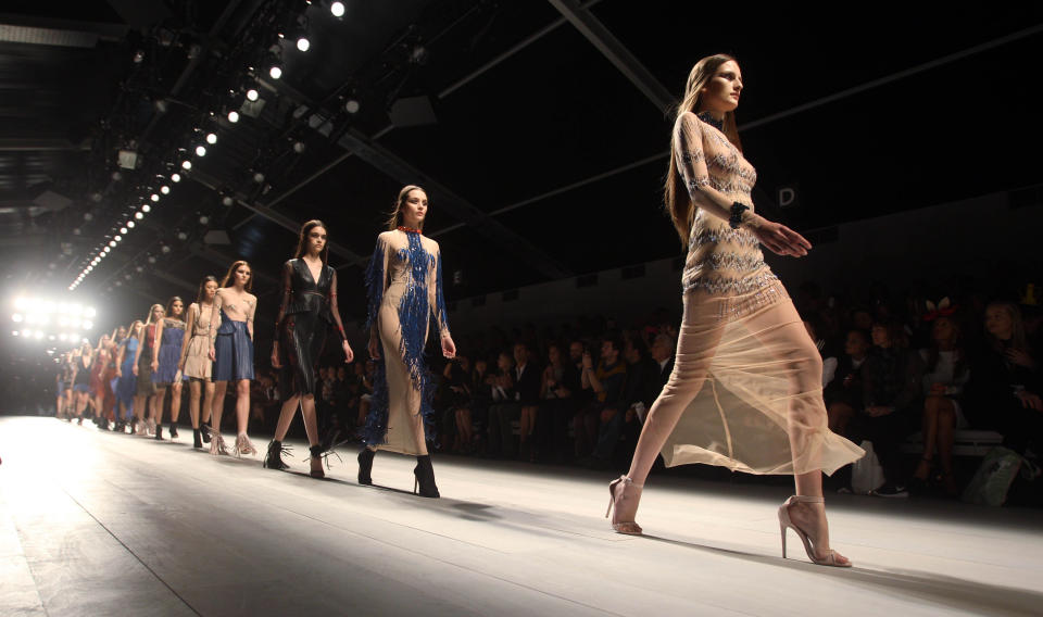 Models wear creations from Marios Schwab during London Fashion Week, Sunday, Sept. 16, 2012. (AP Photo/PA, Lewis Whyld) UNITED KINGDOM OUT