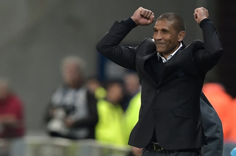 Marseille's interim coach Franck Passi (C) celebrates at the end of the French Cup semi-final match against Sochaux on April 20, 2016