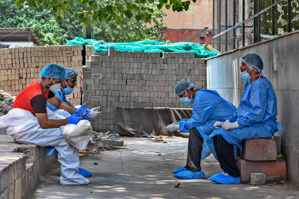 Medical professionals wearing PPE coveralls seen outside the Covid-19 ward at LNJP Hospital, on June 9, 2020 in New Delhi, India. (Photo by Biplov Bhuyan/Hindustan Times via Getty Images)