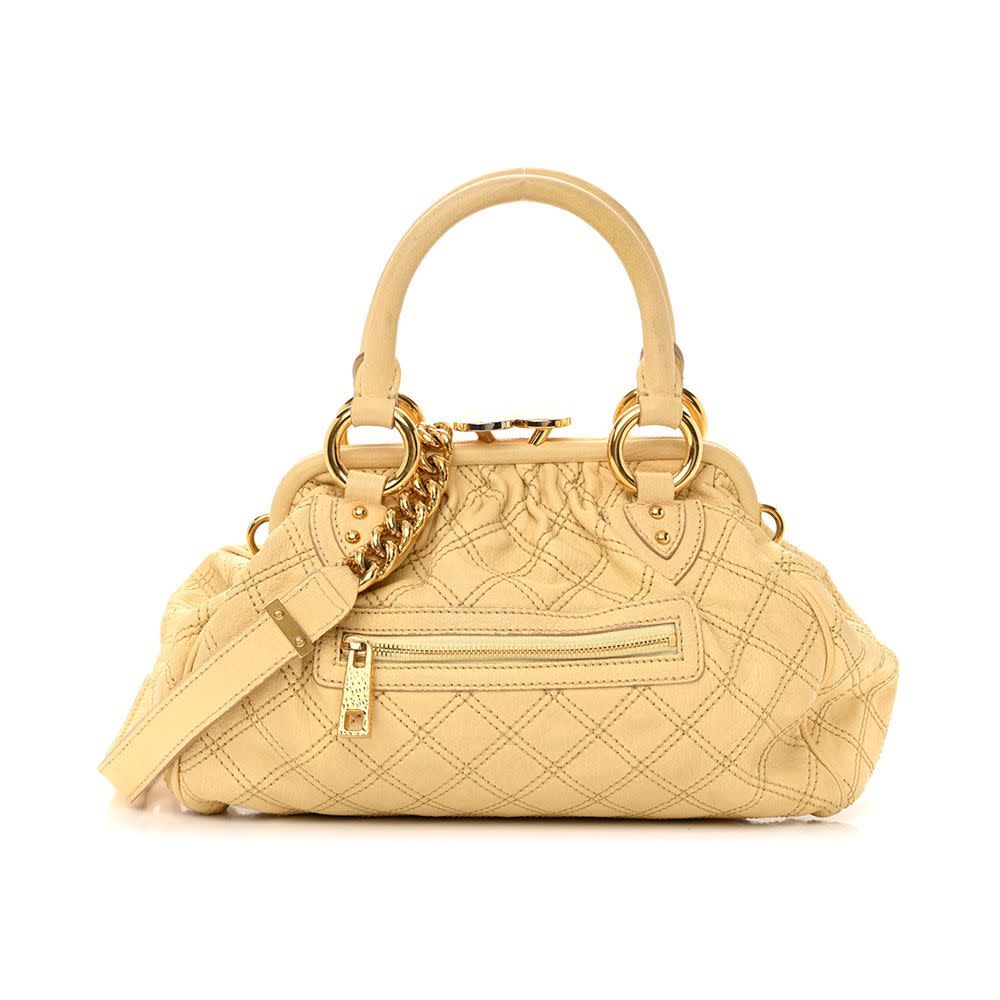 <p><a href="https://go.redirectingat.com?id=74968X1596630&url=https%3A%2F%2Fwww.fashionphile.com%2Fp%2Fmarc-jacobs-calfskin-quilted-stam-light-yellow-1327734&sref=https%3A%2F%2F" rel="nofollow noopener" target="_blank" data-ylk="slk:Shop Now;elm:context_link;itc:0;sec:content-canvas" class="link rapid-noclick-resp">Shop Now</a></p><p>Calfskin Quilted Stam Light Yellow</p><p>fashionphile.com</p><p>$425.00</p>