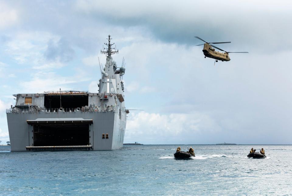 Australia HMAS Canberra soldiers Chinook Tonga