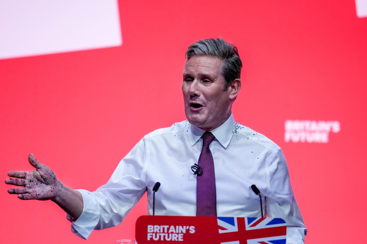 Labour party leader, Sir Keir Starmer delivers the leader’s speech, covered in glitter after a protestor stormed the stage on the third day of the Labour Party conference on 10 October 2023 in Liverpool, England (Getty Images)