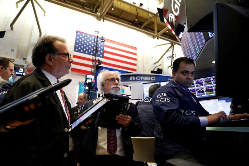 Traders work on the floor of the New York Stock Exchange, (NYSE) in New York
