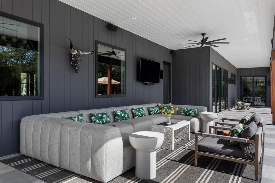 patio with dark walls and tv
