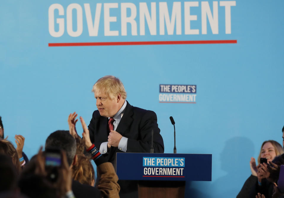 Britain's Prime Minister Boris Johnson gestures after speaking at a campaign event at the Queen Elizabeth II Centre in London, Friday, Dec. 13, 2019. Prime Minister Boris Johnson's Conservative Party has won a solid majority of seats in Britain's Parliament — a decisive outcome to a Brexit-dominated election that should allow Johnson to fulfill his plan to take the U.K. out of the European Union next month. (AP Photo/Frank Augstein)