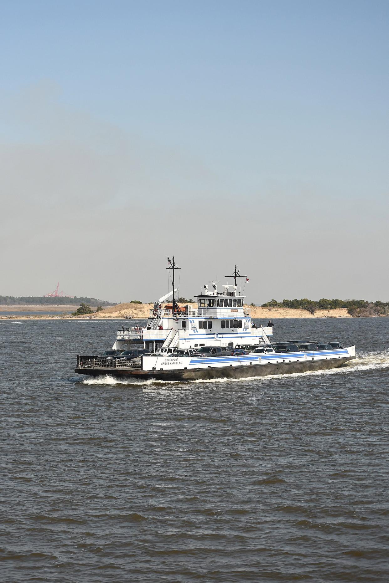 Ferry riders cross the Cape Fear River aboard the Fort Fisher-Southport ferry to make the trip over to Southport on Wednesday March 13, 2024. KEN BLEVINS/STARNEWS