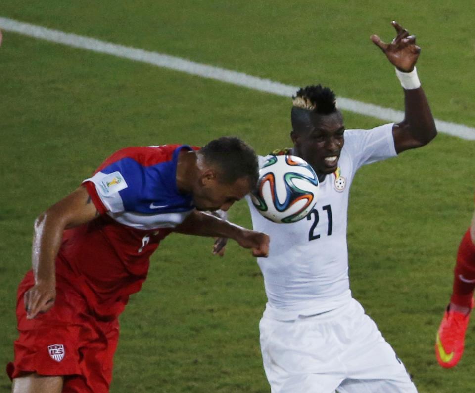 Brooks of the U.S. heads the ball to score a goal