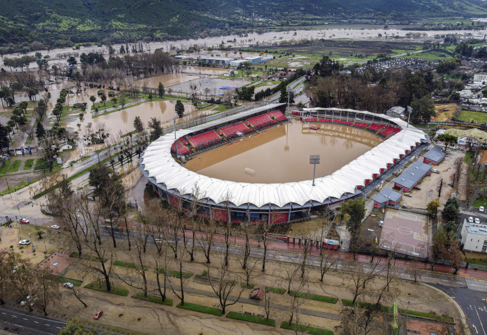 Fiscal de Talca stadium is flooded after the Rio Claro river overflowed during heavy rain in Talca, Chile, Tuesday, Aug. 22, 2023. Chilean government decreed on Tuesday an agricultural emergency in affected regions. (Jose Robles, Aton Chile via AP)