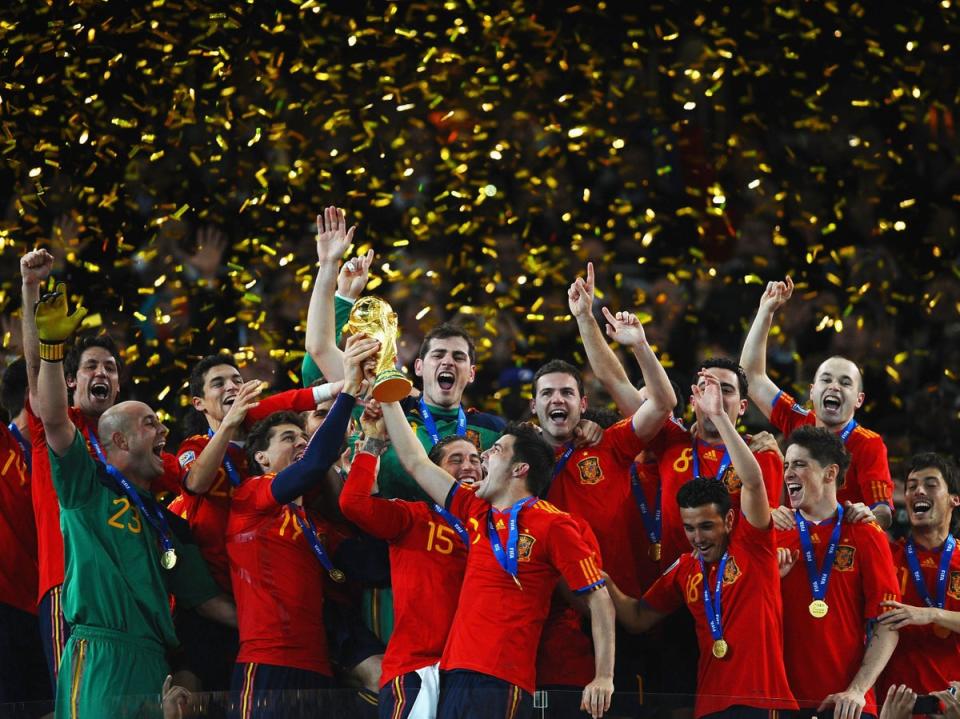 Captain Iker Casillas (centre) and the Spain team celebrate winning the 2010 World Cup  (Getty)