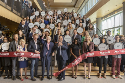 J.W. &quot;Bill&quot; Marriott, Jr., Chairman Emeritus of Marriott International, cuts the ribbon at the grand opening of the company's new Bethesda, MD, headquarters. Flanking Mr. Marriott are David Marriott, Chairman of the Board (left), and Tony Capuano, CEO (right). Also pictured: Marriott President Stephanie Linnartz (third from right), and Debbie Marriott Harrison, Board Member (third from left).