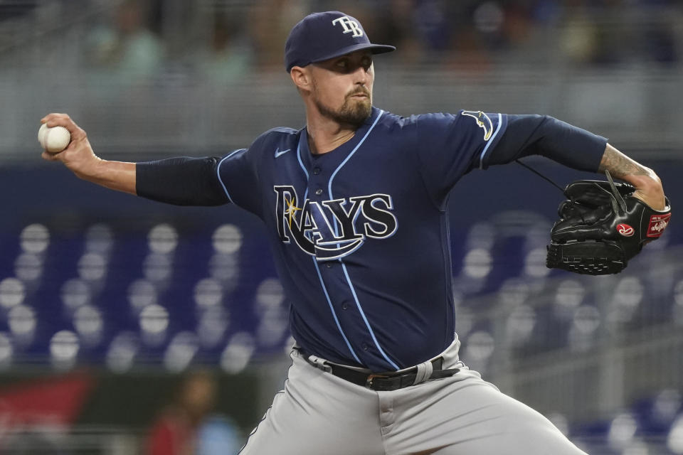 Tampa Bay Rays pitcher Shawn Armstrong (64) aims a pitch during the first inning of a baseball game against the Miami Marlins, Tuesday, Aug. 30, 2022, in Miami. (AP Photo/Marta Lavandier)