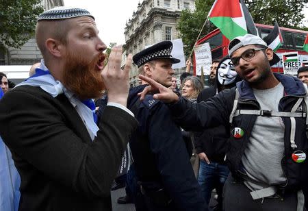 Demonstrators argue during a protest outside Downing Street in London, Britain September 9, 2015. REUTERS/Toby Melville