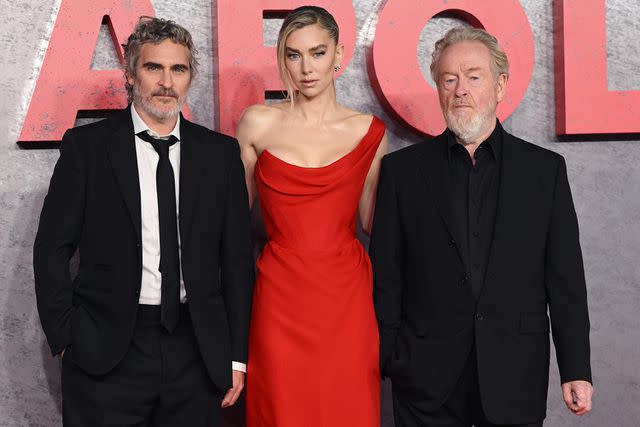 <p>Karwai Tang/WireImage</p> Joaquin Phoenix, Vanessa Kirby and Ridley Scott at the U.K. premiere of "Napoleon" in London on Nov. 16, 2023.