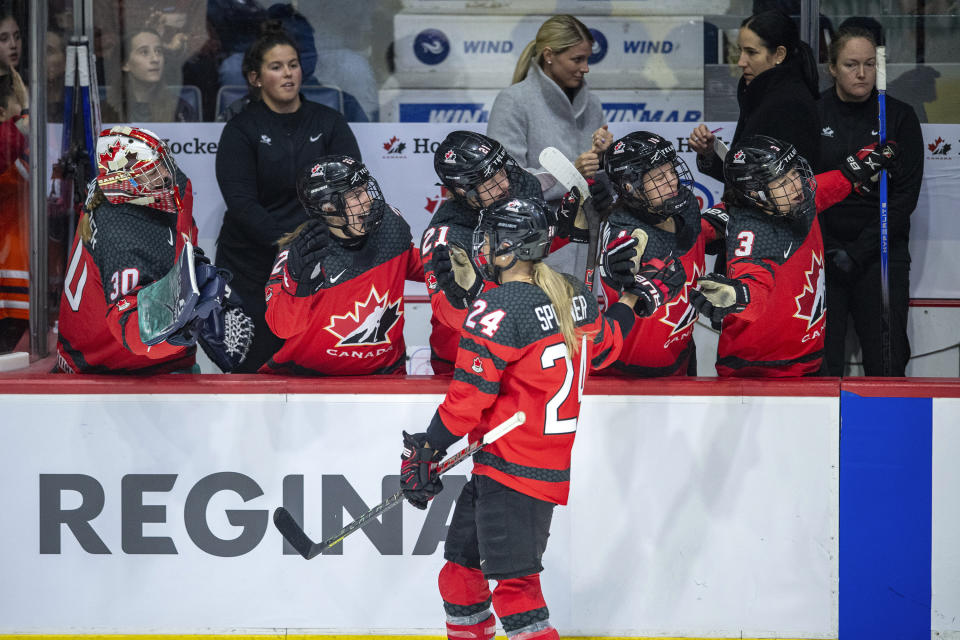 Canada's Natalie Spooner (24) is congratulated for a goal against the United States during the third period of a Rivalry Series hockey game Friday, Feb. 9, 2024, in Regina, Saskatchewan. (Liam Richards/The Canadian Press via AP)