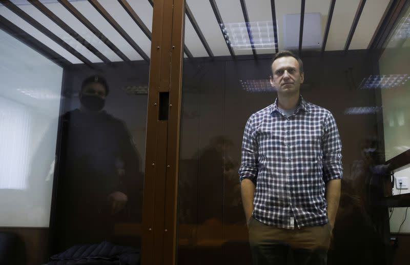 FILE PHOTO: Russian opposition politician Alexei Navalny attends a court hearing earlier court decision to change his suspended sentence to a real prison term