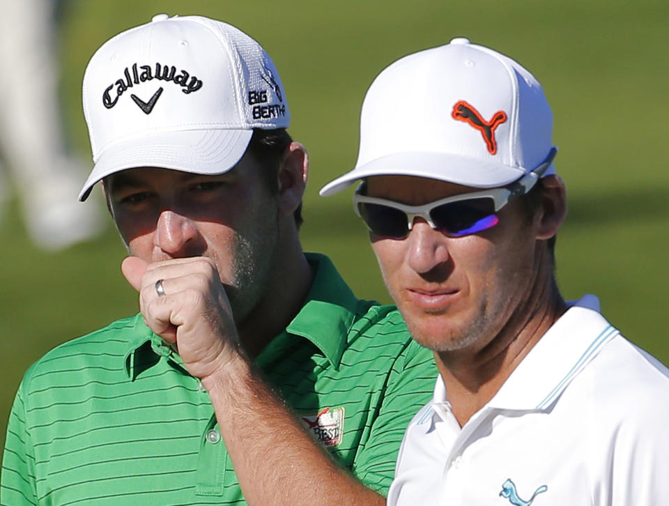 Matt Every, left, and Will MacKenzie watch a putt on the eighth green during the second round of the Humana Challenge PGA golf tournament on the Palmer Private course at PGA West, Friday, Jan. 17, 2014, in La Quinta, Calif. (AP Photo/Matt York)