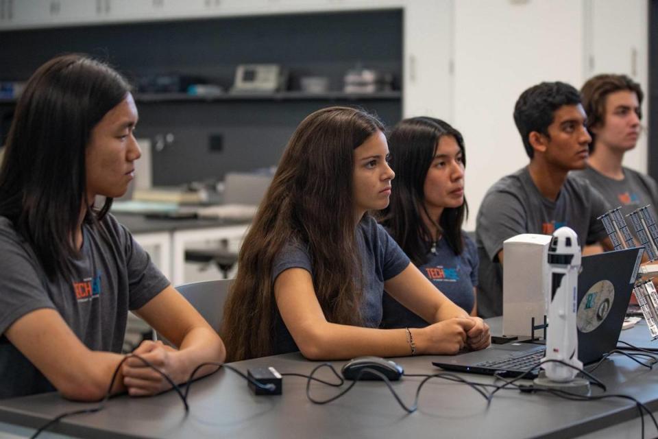 Ransom Everglades School seniors (L-R) Theodore Ma, Sofia Paraoulaki de Miranda, Dadly Leon, Arjun Badwal, and Adrian Stone Perez discuss with a NASA scientist before testing their rocket payload in advance of an actual launch into space on a Blue Origin’s New Shepard rocket with a simulation on Friday, Sept., 18, 2022.