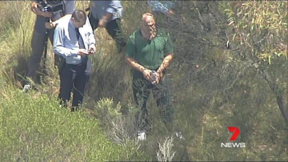The accused killer is taking police through bushland near Sydney. Photo: 7 News