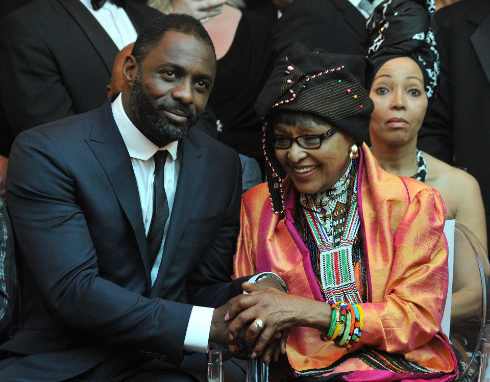Nelson Mandela's second wife Winnie MadikizelaMandela (R) and British actor Idris Elba, who plays the role of Nelson Mandela in the movie 'Mandela, Long Walk to Freedom', attend the movie's premiere in Johannesburg on November 3, 2013. The movie 'Mandela, Long Walk to Freedom', largely based on his autobiography of the same name, traces the life of the anti-apartheid icon from his childhood in the rural Eastern Cape to his election as the country's first black president in 1994. AFP PHOTO / ALEXANDER JOE        (Photo credit should read ALEXANDER JOE/AFP/Getty Images)