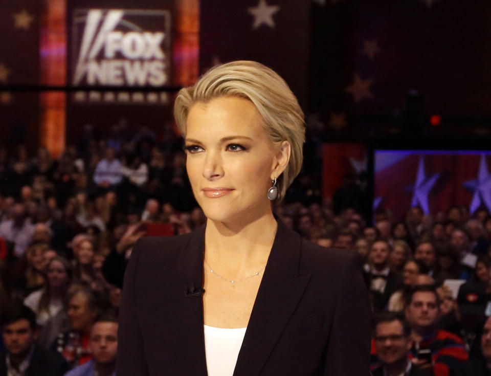 FILE - In this Jan. 28, 2016 photo, Moderator Megyn Kelly waits for the start of the Republican presidential primary debate in Des Moines, Iowa.Kelly says she did the “twirl” before Roger Ailes, too. The former Fox News Channel personality referred to a scene in the movie “Bombshell,” where the late Fox News boss, portrayed by John Lithgow, asked an aspiring news anchor played by actress Margot Robbie to turn around in front of him so he could assess her body. (AP Photo/Chris Carlson, File)