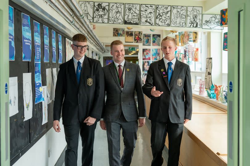 Head teacher Paul Marshall with two pupils