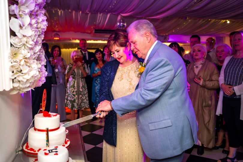 Tom and Denise Nolan cut their wedding cake on 17 June, 2024