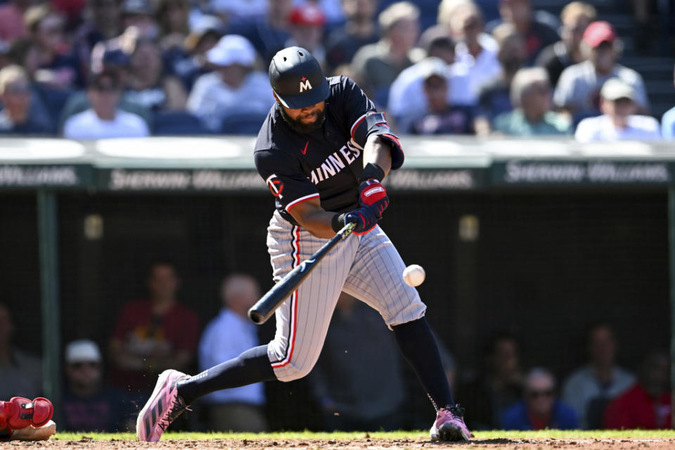 Minnesota Twins’ Manuel Margot hits a two-run double during the fifth inning of a baseball game against the Cleveland Guardians, Thursday, Sept. 19, 2024, in Cleveland. (AP Photo/Nick Cammett)