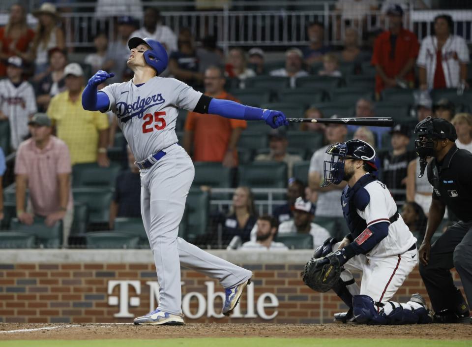 Trayce Thompson hits a two-run single in the ninth inning during the Dodgers' 5-3 win over the Atlanta Braves on Sunday.