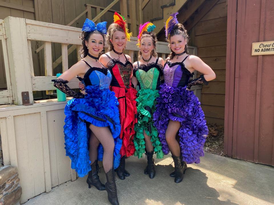 Heather Stolfa, green dress, and Madison Foreman, red dress, pose for a photo inside the Saloon at Silver Dollar City in 2019. Stofla has performed in the Saloon since 2019. Foreman performed in the Saloon for 10 years.