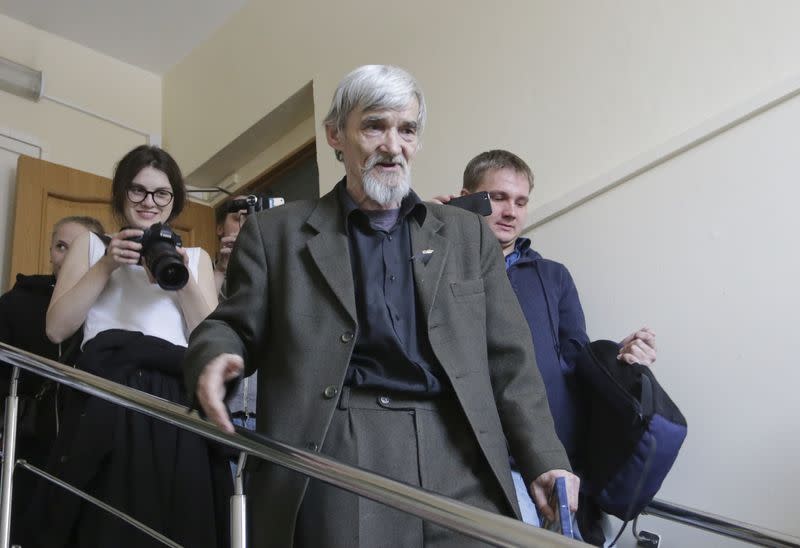 FILE PHOTO: Historian Yuri Dmitriev walks inside a court building in Petrozavodsk