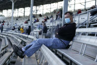 Fans watch during a practice session for an IndyCar auto race at Indianapolis Motor Speedway, Thursday, Oct. 1, 2020, in Indianapolis. (AP Photo/Darron Cummings)