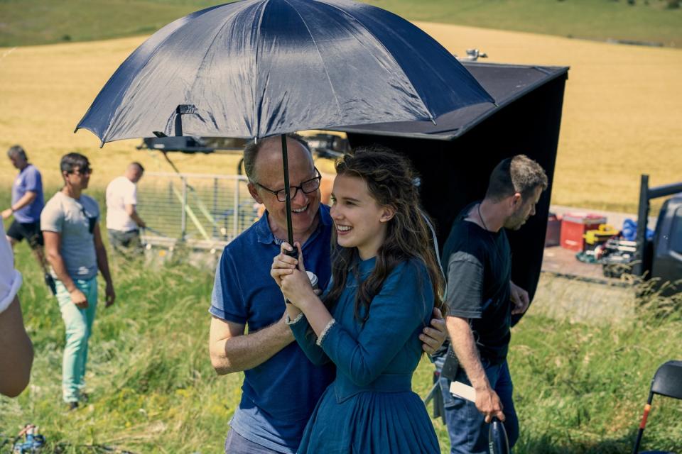 Harry Bradbeer and Millie Bobby Brown under an umbrella
