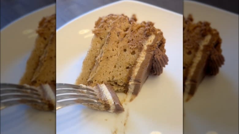 Fork cutting slice of Biscoff cake