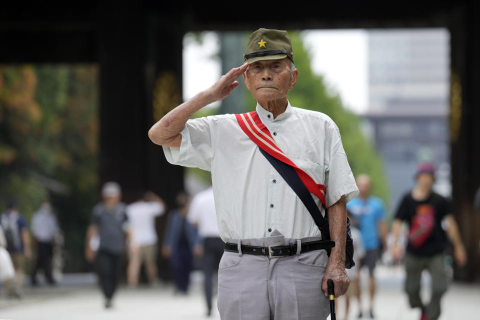 A visitor salutes at the Yasukuni Shrine, which honors Japan's war dead, Tuesday, Aug. 15, 2023, in Tokyo. Japan holds annual memorial service for the war dead as the country marks the 78th anniversary of its defeat in the World War II. (AP Photo/Eugene Hoshiko)