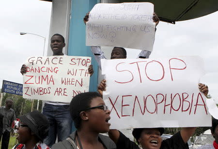 Zimbabweans hold a demonstration against the violence outside the South African Embassy in Harare, April 17, 2015. REUTERS/Philimon Bulawayo