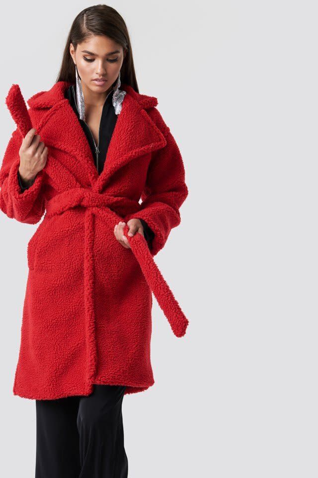 This red coat has a button closure, side pockets and a removable waist belt. <strong><a href="https://fave.co/31cjPIS" target="_blank" rel="noopener noreferrer">Find it for $118 at NA-KD</a></strong>.