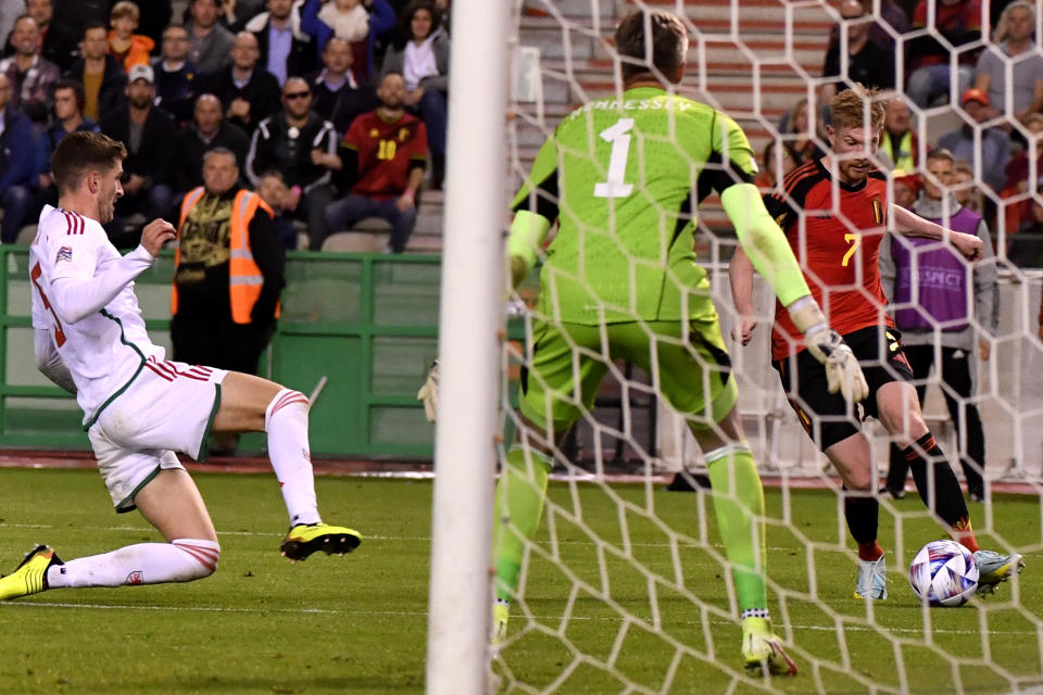 Belgium's Kevin De Bruyne, right, makes an attempt on goal during the Nations League soccer match between Belgium and Wales at the King Baudouin Stadium in Brussels, Thursday, Sept. 22, 2022. (AP Photo/Geert Vanden Wijngaert)