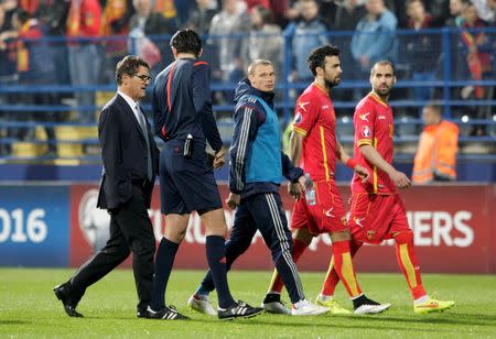 Referee Deniz Aytekin (2nd L) of Germany talks to Russia's soccer team coach Fabio Capello (L) as they leave the pitch during the Euro 2016 Group G qualifying soccer match between Russia and Montenegro in Podgorica March 27, 2015. REUTERS/Stevo Vasiljevic